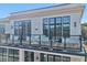 Private balcony with glass railings and wood decking at 8200 Main S St # 1306, Woodstock, GA 30188