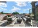 Spacious rooftop deck with fire pit, comfortable seating, and city views at 8200 Main S St # 1306, Woodstock, GA 30188