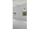 Bedroom with two large windows and unfinished flooring at 8200 Main S St # 1306, Woodstock, GA 30188