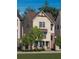 Beige two-story home with gray roof and landscaping at 2290 Park Walke Dr, Alpharetta, GA 30009
