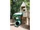Green spiral playground slide next to wooden play structure at 2290 Park Walke Dr, Alpharetta, GA 30009