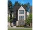 Three-story home with stone and dark siding at 2300 Park Walke Dr, Alpharetta, GA 30009