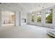 Spacious living room with large windows and fireplace at 8200 Main S St # 1208, Woodstock, GA 30188