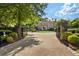 Brick pillars and wrought iron gate leading to home at 3560 Ridgewood Nw Rd, Atlanta, GA 30327