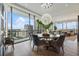 Elegant dining room with a round table, modern chandelier, and city views at 3107 Peachtree Ne Rd # 1101, Atlanta, GA 30305