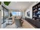 Spacious living room boasts floor-to-ceiling windows with city views, stylish furnishings, and built-in shelving at 3107 Peachtree Ne Rd # 1101, Atlanta, GA 30305