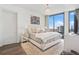 Bright bedroom with a king-size bed and stunning city views at 3107 Peachtree Ne Rd # 1101, Atlanta, GA 30305