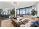 Luxury living room with sectional sofa, large windows, and city views at 3107 Peachtree Ne Rd # 1101, Atlanta, GA 30305