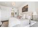 Serene bedroom with a plush bed, a chandelier, and adjacent bathroom at 3107 Peachtree Ne Rd # 1101, Atlanta, GA 30305