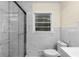 Updated bathroom with a walk-in shower and marble tile at 4440 Stonewall Tell Rd, Atlanta, GA 30349