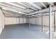 Unfinished basement with high ceilings and concrete floors at 4440 Stonewall Tell Rd, Atlanta, GA 30349