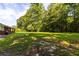 Brick ranch house with covered patio and large backyard at 4440 Stonewall Tell Rd, Atlanta, GA 30349