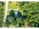 House and driveway from above, surrounded by trees at 4440 Stonewall Tell Rd, Atlanta, GA 30349