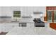 Modern kitchen with white cabinets and granite countertops at 4440 Stonewall Tell Rd, Atlanta, GA 30349