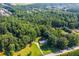 Aerial view showing home nestled in a wooded area at 4440 Stonewall Tell Rd, Atlanta, GA 30349