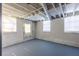 Unfinished basement with concrete floor and exterior access at 4440 Stonewall Tell Rd, Atlanta, GA 30349