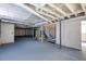 Unfinished basement with high ceilings and exposed pipes at 4440 Stonewall Tell Rd, Atlanta, GA 30349