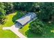 Aerial view of a ranch house with a large yard and driveway at 4440 Stonewall Tell Rd, Atlanta, GA 30349