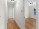 Hardwood floors and neutral walls in the hallway at 4440 Stonewall Tell Rd, Atlanta, GA 30349