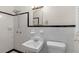 Retro bathroom with white and black tile at 4440 Stonewall Tell Rd, Atlanta, GA 30349