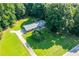 Aerial view of a ranch house with a large yard and driveway at 4440 Stonewall Tell Rd, Atlanta, GA 30349