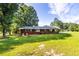 Brick ranch house with covered patio and large backyard at 4440 Stonewall Tell Rd, Atlanta, GA 30349