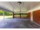 Covered patio with concrete flooring and brick walls at 4440 Stonewall Tell Rd, Atlanta, GA 30349