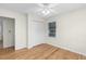 Hardwood floor bedroom with ceiling fan and closet at 4440 Stonewall Tell Rd, Atlanta, GA 30349