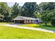 Brick ranch house with carport and large backyard at 4440 Stonewall Tell Rd, Atlanta, GA 30349