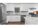 Modern kitchen with white cabinets and granite countertops at 4440 Stonewall Tell Rd, Atlanta, GA 30349