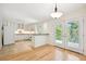 Open concept dining area with hardwood floors and access to patio at 1261 Lavista Rd # F-3, Atlanta, GA 30324