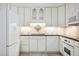 Bright white kitchen features granite countertops and stainless steel appliances at 1261 Lavista Rd # F-3, Atlanta, GA 30324