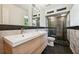Modern bathroom with double vanity, large shower, and marble tile at 1261 Lavista Rd # F-3, Atlanta, GA 30324