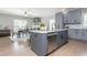 Spacious kitchen boasts gray cabinets, granite countertops, and a large island at 12 Ivy Chase Nw Way, Cartersville, GA 30121
