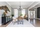 Bright dining room with hardwood floors, chandelier, and view into living room at 12 Ivy Chase Nw Way, Cartersville, GA 30121