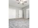 Spacious bedroom with carpet flooring, ceiling fan and double-door closet at 12 Ivy Chase Nw Way, Cartersville, GA 30121