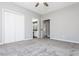 Spacious bedroom with carpet flooring, ceiling fan and en-suite bathroom at 12 Ivy Chase Nw Way, Cartersville, GA 30121
