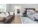 Main bedroom with sitting area and access to private deck at 12 Ivy Chase Nw Way, Cartersville, GA 30121