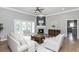 Open living room with hardwood floors, fireplace, and access to kitchen at 12 Ivy Chase Nw Way, Cartersville, GA 30121