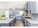 Modern kitchen with gray cabinets, granite countertops and stainless steel appliances at 12 Ivy Chase Nw Way, Cartersville, GA 30121