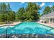 Community pool with lounge chairs and a clubhouse at 12 Ivy Chase Nw Way, Cartersville, GA 30121