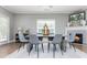 Spacious dining room with hardwood floors, fireplace, and access to deck at 12 Ivy Chase Nw Way, Cartersville, GA 30121