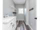 Laundry room with white cabinets, shelving and vinyl flooring at 12 Ivy Chase Nw Way, Cartersville, GA 30121