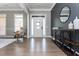 Bright entryway with hardwood floors, a white door, and a modern console table at 12 Ivy Chase Nw Way, Cartersville, GA 30121