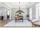 Elegant dining room featuring hardwood floors, a chandelier, and large windows at 12 Ivy Chase Nw Way, Cartersville, GA 30121