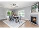 Bright dining room with hardwood floors, fireplace and large windows at 12 Ivy Chase Nw Way, Cartersville, GA 30121