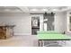 Finished basement with ping pong table, wet bar, and access to home gym at 1095 Mockingbird Ln, Cumming, GA 30041