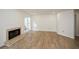 Spacious living room with fireplace and wood-look floors at 1666 Paddlewheel Dr, Marietta, GA 30062