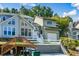 Two-story townhome with a landscaped yard and attached garage at 1666 Paddlewheel Dr, Marietta, GA 30062