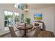 Round dining table in bright dining room with hardwood floors and large windows at 1666 Paddlewheel Dr, Marietta, GA 30062